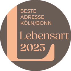 Das runde Logo zeigt die Auszeichnung "Lebensart 2025" für die Schlafprofis als beste Adresse für Köln/Bonn